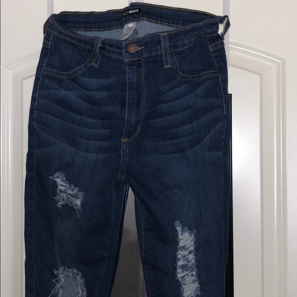 Ripped dark blue jeans
